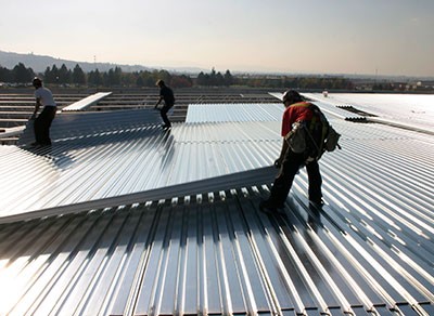 Metal Decking being installed on a roof